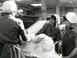Workers at Wilkinson sweet factory in Pontefract, Yorkshire chatting during their shift Workers at Wilkinson sweet factory in Pontefract, Yorkshire chatting during their shift