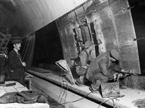 Workman lining the new Mersey Tunnel with glass. This tunnel is probably The Workman lining the new Mersey Tunnel with glass. This tunnel is probably The