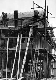 Workmen in action roofing old houses from Much Park Street, Coventry Workmen in action roofing old houses from Much Park Street, Coventry