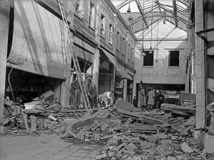 Workmen inspect the damage to The Arcade in Coventry following a raid on the city Workmen inspect the damage to The Arcade in Coventry following a raid on the city