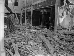 Workmen inspect the damage to F W Woolworth and The Arcade in Coventry following a raid Workmen inspect the damage to F W Woolworth and The Arcade in Coventry following a raid