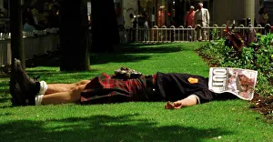 World Cup France June 1998 Scotland fan asleep lying in St Etienne garden with Daily World Cup France June 1998 Scotland fan asleep lying in St Etienne garden with Daily