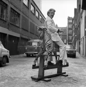 Wrestler Jackie Pallo poses with a rocking horse. February 1975 Wrestler Jackie Pallo poses with a rocking horse. February 1975
