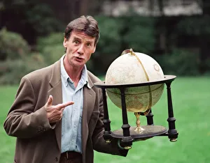 Writer and actor Michael Palin with a globe. 8th October 1992 Writer and actor Michael Palin with a globe. 8th October 1992