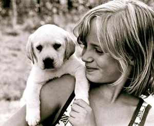 Ten year old Amanda Littlechild holds a puppy in her hands at her home in Kent Ten year old Amanda Littlechild holds a puppy in her hands at her home in Kent