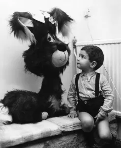 Two year old Benjamin Ross looks on in wonder at the giant toy dog at Riche of Hay Hill Two year old Benjamin Ross looks on in wonder at the giant toy dog at Riche of Hay Hill
