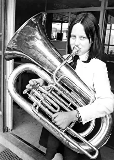 Nine year old Pamela Henderson rehearsing her part with her E-flat Bass Tuba in Nine year old Pamela Henderson rehearsing her part with her E-flat Bass Tuba in