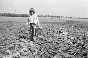 Images Dated 9th August 1976: Young boy goes for a spot of fishing at dried out Edgbaston reservoir in Birmingham