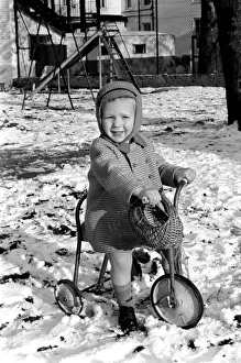 Young boy Robert playing on his bicycle in the snow. November 1969 Z11486 Young boy Robert playing on his bicycle in the snow. November 1969 Z11486