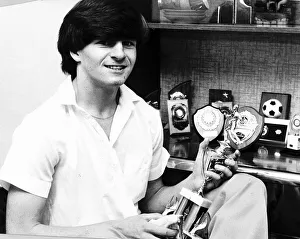 A young Charlie Nicholas Celtic football player with trophies A young Charlie Nicholas Celtic football player with trophies