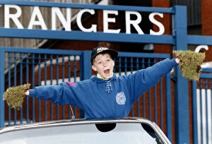 Images Dated 9th May 1993: Young Colin Wilson can t believe it as he proudly shows off his bits of Ibrox turf