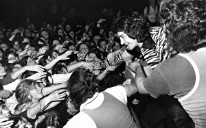 Young fans try to pull DJ Tiger Tim Stevens from the stage in Shuffles Disco during Young fans try to pull DJ Tiger Tim Stevens from the stage in Shuffles Disco during