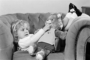 A young girl with a Teddy Ruxpin toy. 21st October 1986 A young girl with a Teddy Ruxpin toy. 21st October 1986