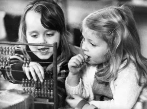 These young girls learn the art of calculating with the help of a abacus These young girls learn the art of calculating with the help of a abacus