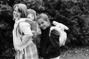 Two young girls wearing soft toy rucksacks. 21st October 1986 Two young girls wearing soft toy rucksacks. 21st October 1986