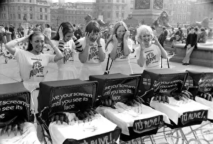 Six young ladies pushing prams on a sunny day in Trafalgar Square Six young ladies pushing prams on a sunny day in Trafalgar Square