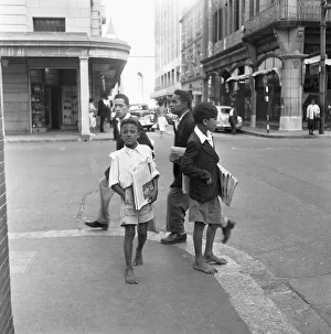 Young newspaper vendors on the streets of Cape Town selling copies of the Cape Argus Young newspaper vendors on the streets of Cape Town selling copies of the Cape Argus