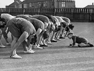 The young Peter Downer looks for his mother during an exercise class held for mothers at The young Peter Downer looks for his mother during an exercise class held for mothers at
