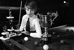 A young Stephen Hendry poses with some of his trophies shortly after becoming the first A young Stephen Hendry poses with some of his trophies shortly after becoming the first