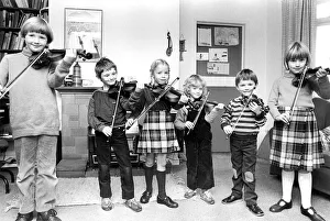 Young violinists getting in some practice in October 1982 Young violinists getting in some practice in October 1982