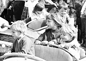 Some youngsters enjoy a small white knuckle ride, at least it is to them Some youngsters enjoy a small white knuckle ride, at least it is to them