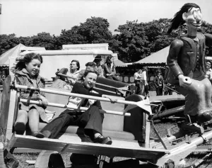 Youngsters on the Roundabout ride at the Hoppings fair, held on the Town Moor in Youngsters on the Roundabout ride at the Hoppings fair, held on the Town Moor in