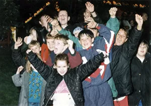 Images Dated 23rd September 1993: Youngsters salute Manchester 2000 Olympic Bid hopes at Piccadilly Gardens firework