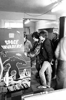 Images Dated 1st December 1980: Youths play on a Space Invaders machine in Newcastle in December 1980