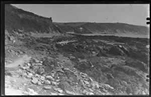 People in rock pools, Milendreath near Looe in distance People in rock pools, Milendreath near Looe in distance