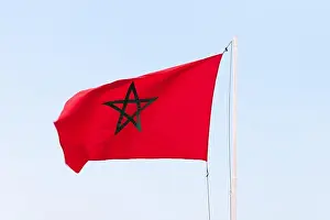 Morocco Flag Print against a Blue Sky