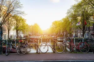 Bike Print over Amsterdam Canal at Sunset