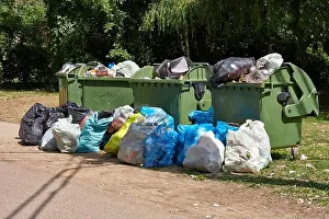 Garbage Containers Print: Full, Overflowing Dumpsters