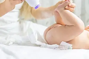 The Mother Changes the Babys Diaper Print