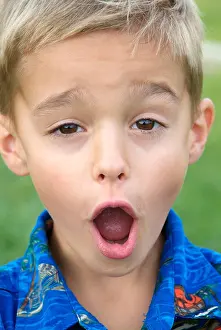 Eight Year Old Boy Makes Faces to the Camera Print