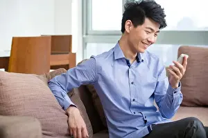 Young Man Using Smartphone Print