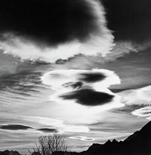 Mountain Cloud Formations Prints: Clouds over a mountain landscape