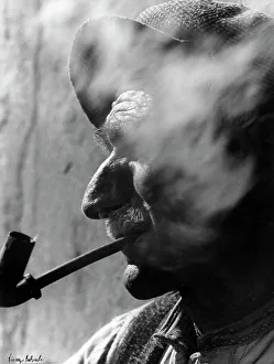 Human Body Parts Photography Prints: Face of elderly man with pipe