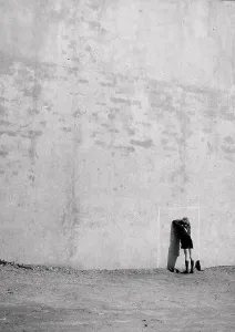 A boy counting against a wall during a game