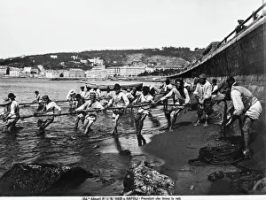 Seaside Landscape Photography Prints: Fishermen pulling in their nets on a Neapolitan beach