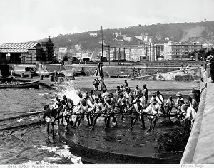 Fishermen pulling the nets, on a pier in Naples