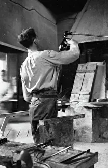 Glass blower at work in a studio in Murano