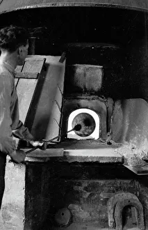 Glassblower working in a studio in Murano