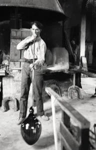 Glassblower working in a studio in Murano