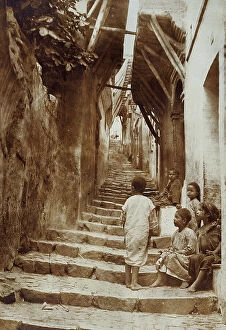 Related Images Collection: Group of children sitting on a stairway, Algeria
