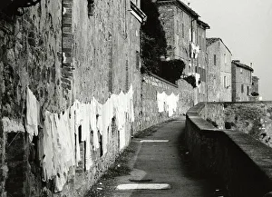 Laundry hung along a wall
