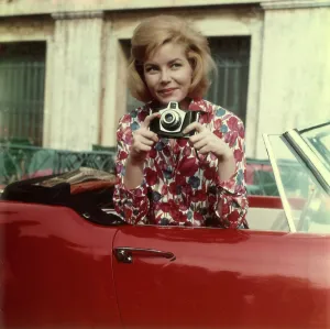 Model posing with a camera