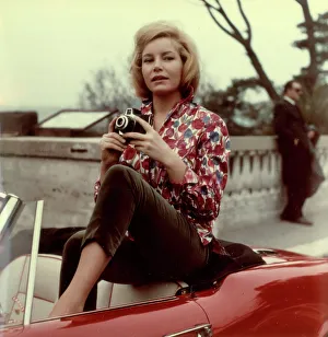 Model posing with a camera