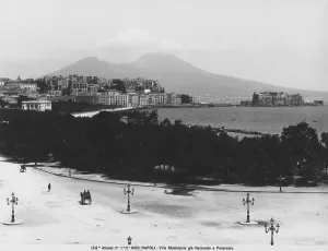 Panoramic view of Naples from Via Caracciolo, flanked by the park of the Villa Comunale (formerly Villa Nazionale). Mount Vesuvius can be seen in the background