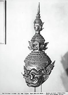 Paper mch mask representing the Devil Birab, preserved in the Department of Fine Arts in Bangkok. Masked, used during dances, formed by a big head of animal with two smaller heads on top: One of them represents a monstrous animal, the other one an animal face
