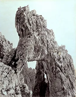 Partial view of the so-called natural arch, a spectacular rock formation rising sheer from the sea in the Island of Capri